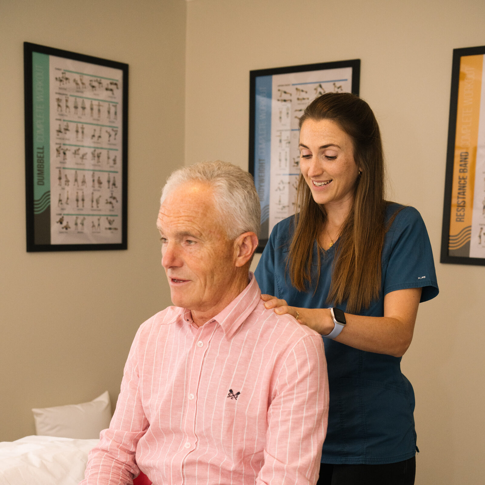 Osteopath assessing a patient