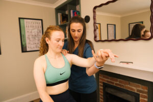evie muir osteopathy treating arm